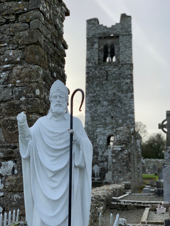 St.Patrick in front of the church tower