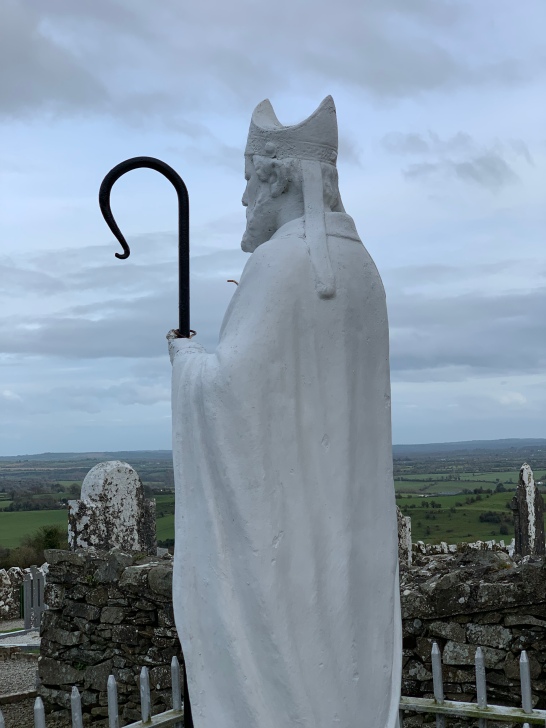 the statue of St.Patrick with his staff surveys the countryside